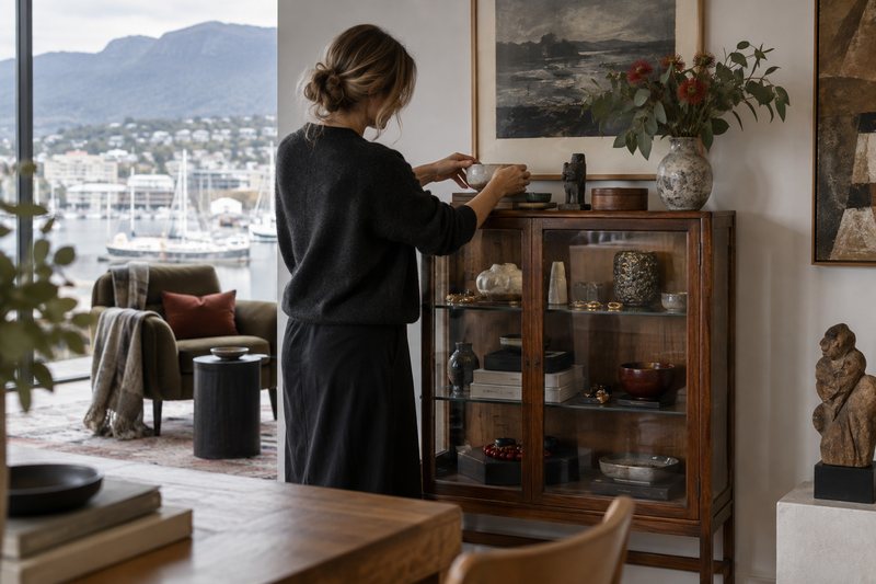 A collector refining a display cabinet in a Hobart interior